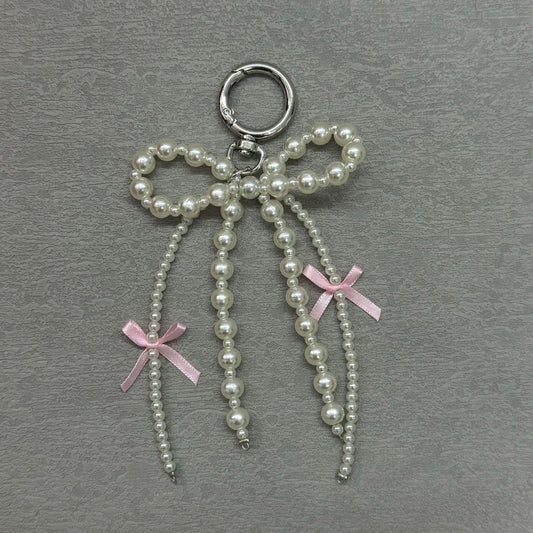 Pearl bow tie bag charm